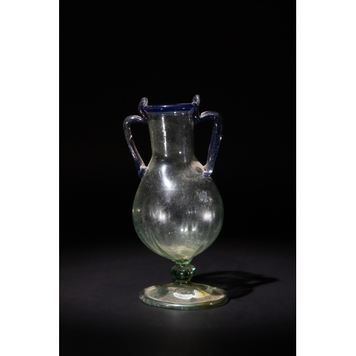 100 - A Roman Green Glass Amphora with Blue Twin Handles.

H: Approximately 13.5cm