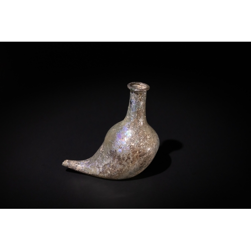 101 - A Roman Glass Feeder-Vessel (Askos), 1st - 2nd Century.

H: Approximately 9.7cm