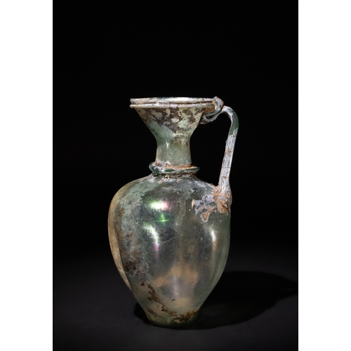 102 - A Roman Green Glass Jug, Circa 2nd-4th Century A.D., with the Body Decorated with Vertical Concave I... 