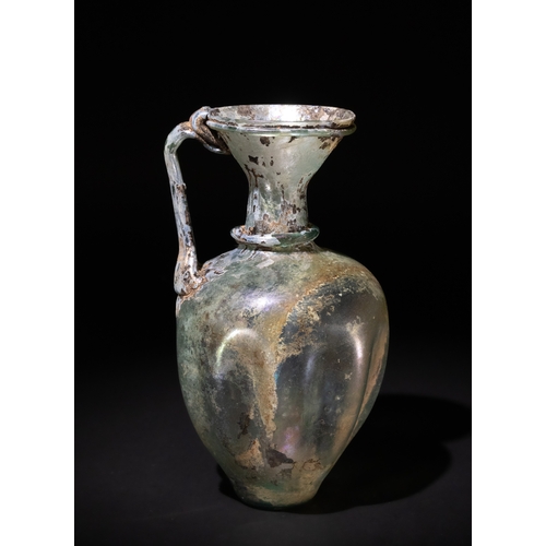 102 - A Roman Green Glass Jug, Circa 2nd-4th Century A.D., with the Body Decorated with Vertical Concave I... 