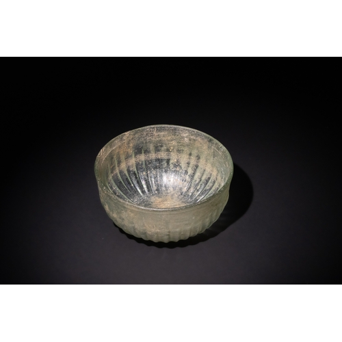 107 - A Hellenistic Greek Green Glass Ribbed Bowl, 1st Century A.D.

D: Approximately 11.5cm
H: Approximat... 