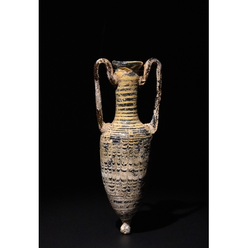 108 - An Eastern Mediterranean Core-Formed Dark Blue Glass Amphora, 1st Century B.C.

H: Approximately 16c... 