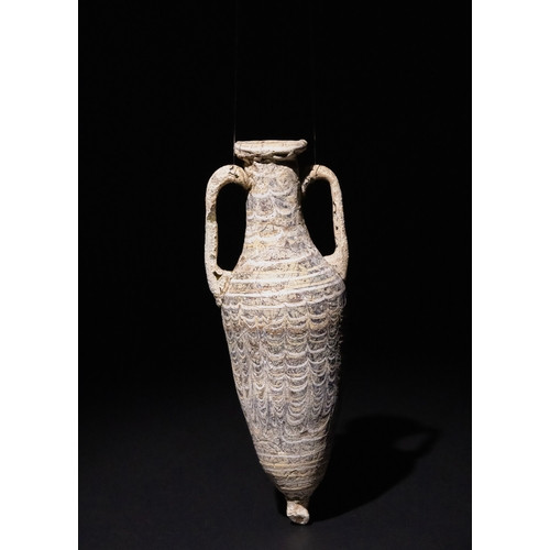 110 - An Eastern Mediterranean Core-Formed Dark Blue Glass Amphora, 1st Century B.C.

H: Approximately 14.... 