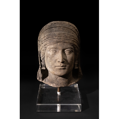 111 - An Eastern Roman Marble Head of a Deity, 1st Century B.C. - 1st Century A.D.

H: Approximately 29cm
... 