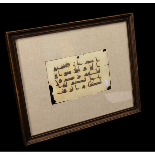 318 - An Islamic Two-sided Kufic Framed Manuscript Fragment.

Approximately 38.5 x 31cm

Provenance: Priva... 