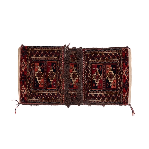 341 - A Turkoman Tekke Miniature Wool Khorjin Saddle Bag, 19th Century.

Approximately 49.5 x 25.5cm

Khor... 