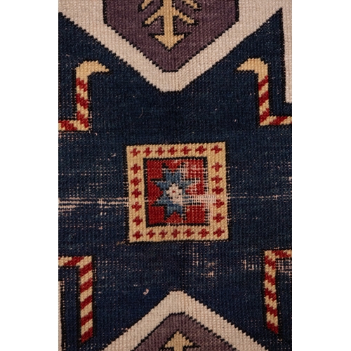 344 - A Caucasian Star Kazak Wool Rug, 19th Century.

Approximately 196 x 172cm

Kazak rugs are known for ... 