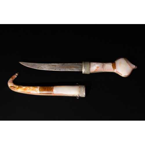 369 - **NO RESERVE** 

A North African Hard Stone Dagger with Cover, 20th Century.

L: Approximately 44cm
... 