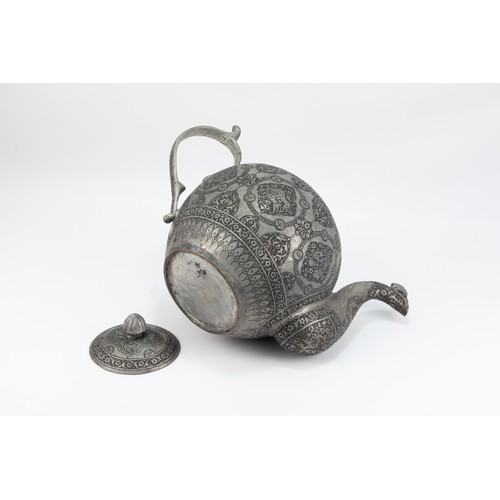 147 - An Indo-Persian Engraved Copper Teapot with Bird Motif Spout, 19th-20th Century.

The teapot feature... 