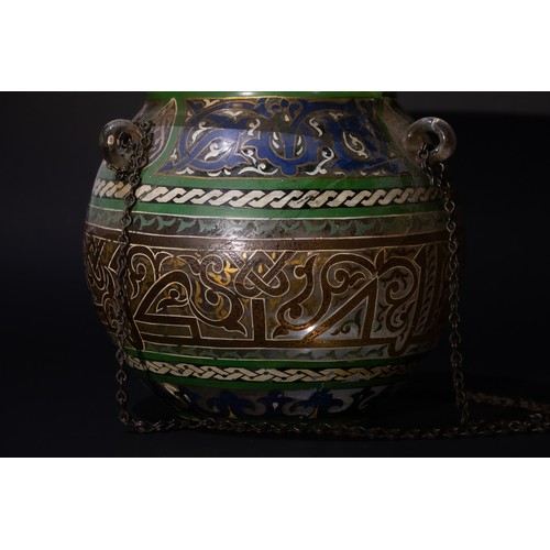 84 - An Islamic Painted Glass Mosque Lamp with Suspension Chains, 19th Century.

This Islamic mosque lamp... 