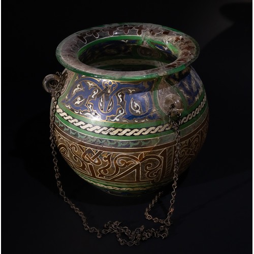 84 - An Islamic Painted Glass Mosque Lamp with Suspension Chains, 19th Century.

This Islamic mosque lamp... 