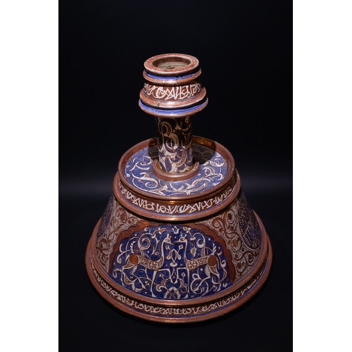 85 - An Islamic Hispano-Moresque Style Lustre Pottery Candlestick, 19-20th Century.

A ceramic candlestic... 