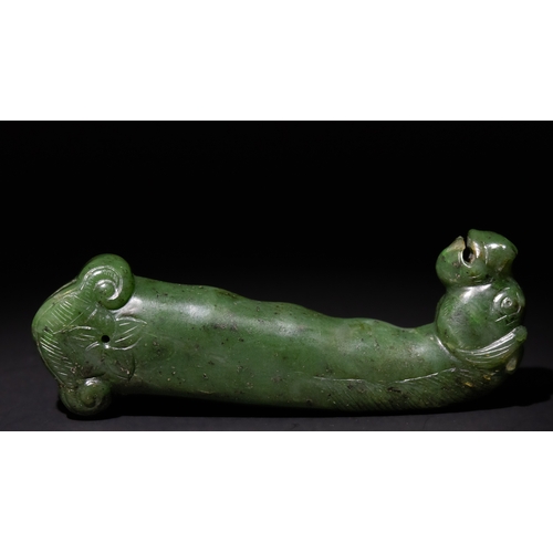 157 - An Indo-Persian Spinach Green Jade Dagger Handle with Carved Animal Motif, 19th-20th Century.

The c... 