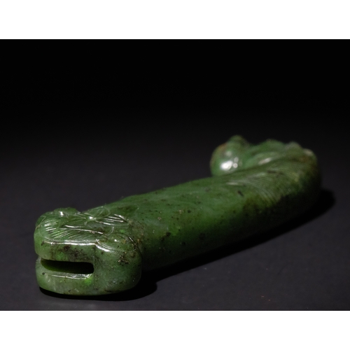 157 - An Indo-Persian Spinach Green Jade Dagger Handle with Carved Animal Motif, 19th-20th Century.

The c... 