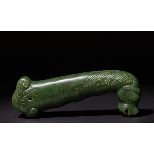 157 - An Indo-Persian Spinach Green Jade Dagger Handle with Carved Animal Motif, 19th-20th Century.

The c... 