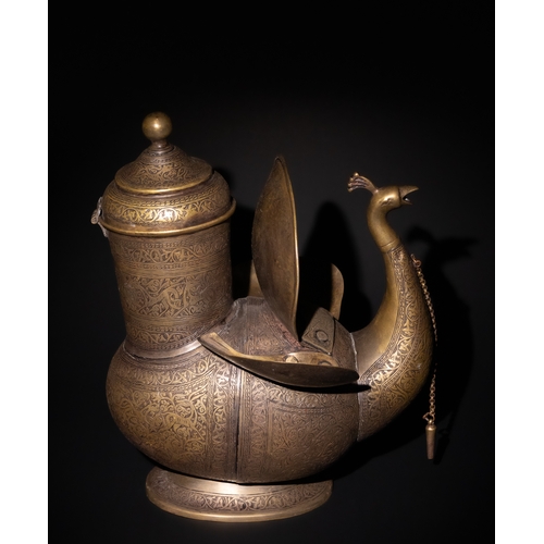 159 - An Indo-Persian Brass Peacock Water Jug.

This exquisite Indo-Persian brass water jug is designed in... 