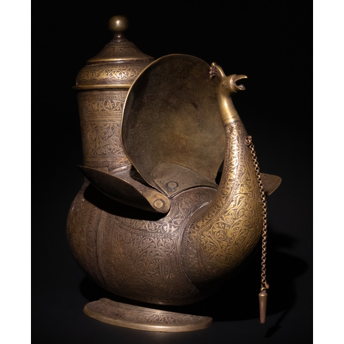 159 - An Indo-Persian Brass Peacock Water Jug.

This exquisite Indo-Persian brass water jug is designed in... 