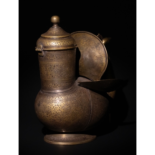 159 - An Indo-Persian Brass Peacock Water Jug.

This exquisite Indo-Persian brass water jug is designed in... 