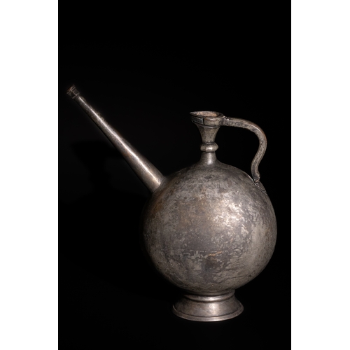 90 - An Islamic Safavid Copper Ewer with Long Spout, 16th-17th Century.

This beautifully crafted Islamic... 