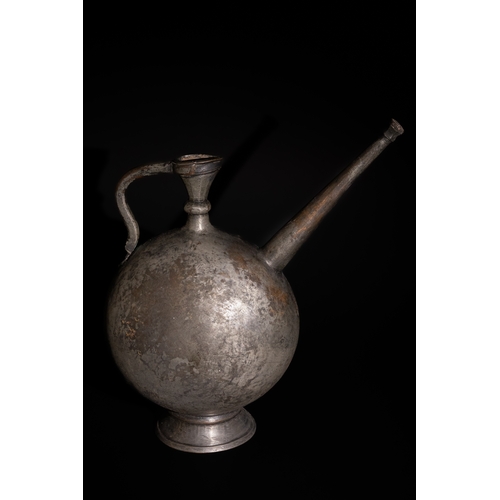 90 - An Islamic Safavid Copper Ewer with Long Spout, 16th-17th Century.

This beautifully crafted Islamic... 