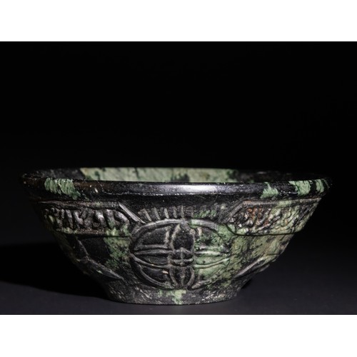 160 - A Mughal-Style Green Jade Bowl with Arabic Calligraphy and Floral Carvings.

The green jade provides... 