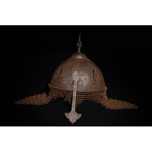 91 - An Islamic Indo-Persian Kulah-Khud Helmet with Calligraphic Engraving and Chainmail.

It features ex... 