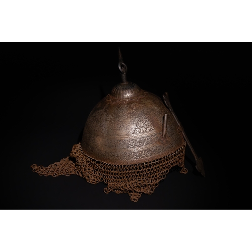 91 - An Islamic Indo-Persian Kulah-Khud Helmet with Calligraphic Engraving and Chainmail.

It features ex... 