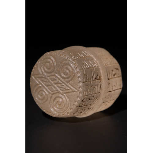 93 - An Islamic Carved Crystal Amulet with Kufic Inscriptions, 10th-12th Century.

The amulet is cylindri... 