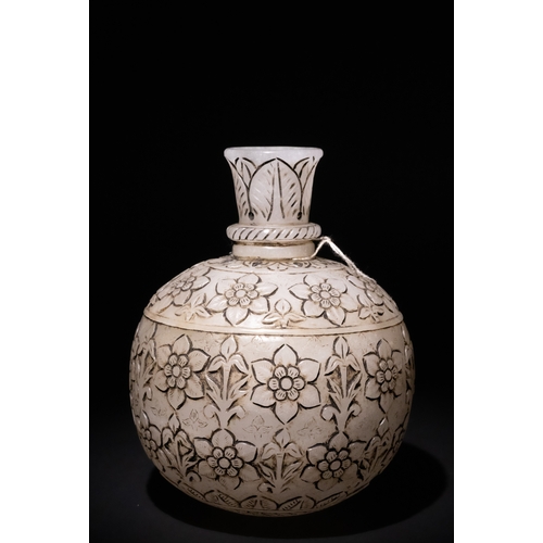 161 - A Mughal-Style Indian Jade Carved Hookah Base with Floral Carvings.

The design features elegant flo... 