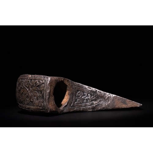 96 - An Islamic Indo-Persian Engraved Iron Axe Head with Calligraphy and Floral Motifs.

The axe head is ... 