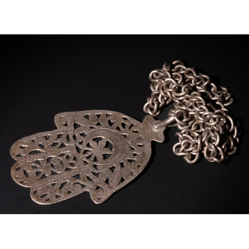 98 - A Tunisian Silver Talismanic Hand Necklace.

A finely crafted silver necklace featuring an intricate... 