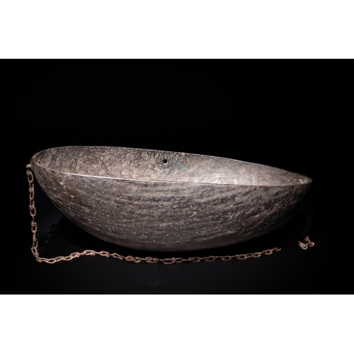 106 - An Islamic Qajar Coco de Mer Kashkul Beggar's Bowl, 19th Century, with Chain.

The bowl's surface is... 