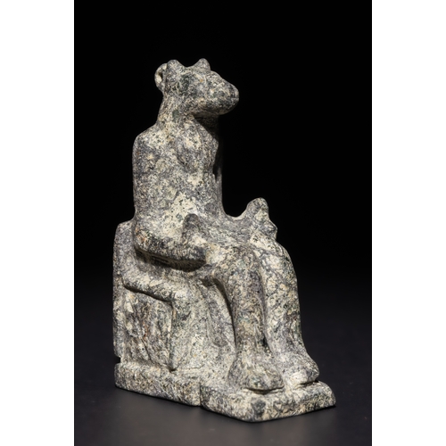 5 - An Egyptian Granitic Statue of a Sitting Figure with Animal Features, Possibly Ancient.

This finely... 