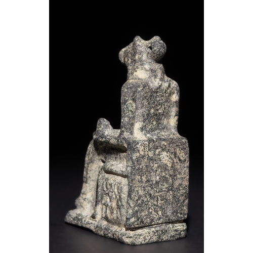 5 - An Egyptian Granitic Statue of a Sitting Figure with Animal Features, Possibly Ancient.

This finely... 