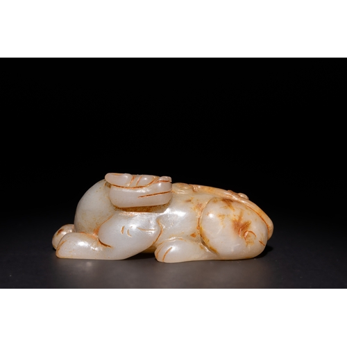 254 - A Chinese Carved Green and Russet Jade Creature, Possibly a Rabbit or Mythical Animal.

This carved ... 