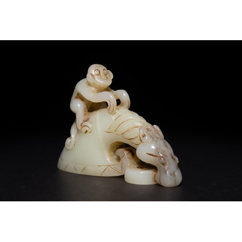 255 - A Chinese Green and Russet Jade Carving of a Monkey Riding a Horse.

This carved Chinese jade sculpt... 