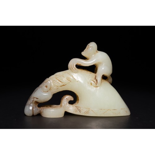 255 - A Chinese Green and Russet Jade Carving of a Monkey Riding a Horse.

This carved Chinese jade sculpt... 