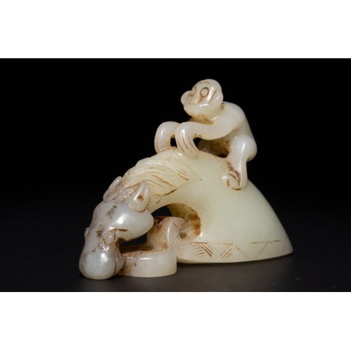 255 - A Chinese Green and Russet Jade Carving of a Monkey Riding a Horse.

This carved Chinese jade sculpt... 