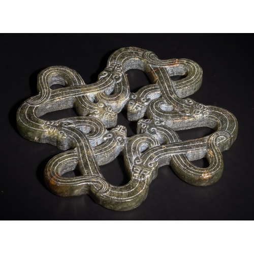 323 - **NO RESERVE**

A Chinese Carved Jade Plaque with Interwoven Dragon Motifs.

This Chinese jade plaqu... 