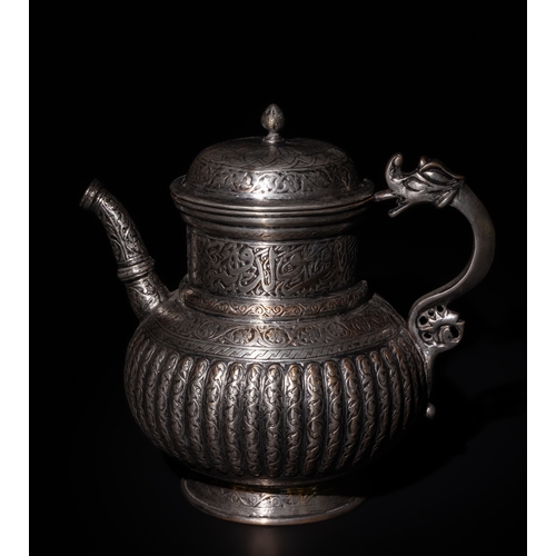 107 - An Islamic Timurid Copper Lidded Water Jug with Intricate Engraving.

The teapot is adorned with scr... 