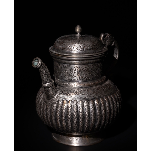 107 - An Islamic Timurid Copper Lidded Water Jug with Intricate Engraving.

The teapot is adorned with scr... 