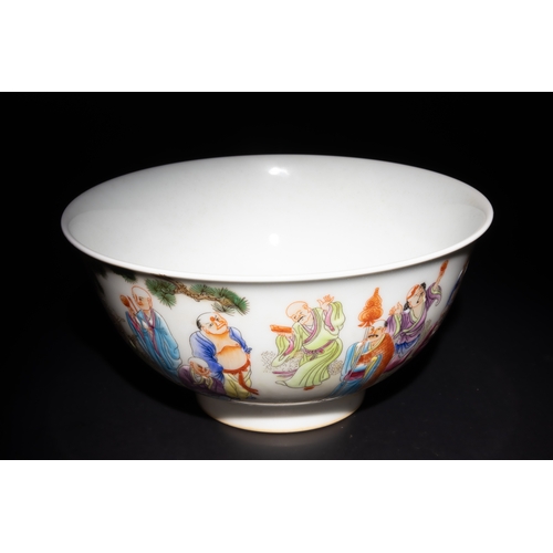 262 - A Chinese Famille Rose Bowl with Outdoor Figures and 4 Character Marks to the Base.

This Chinese po... 