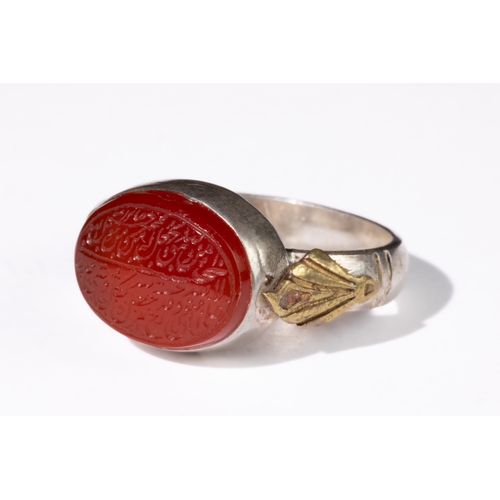 328 - **NO RESERVE**

An Islamic Agate Silver Ring with Calligraphic Inscription.

This Islamic agate ring... 