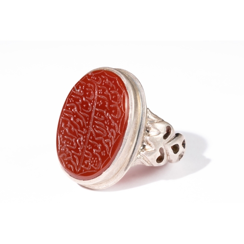 329 - **NO RESERVE** 

An Islamic Agate Silver Ring with Calligraphic Inscription.

This Islamic ring feat... 