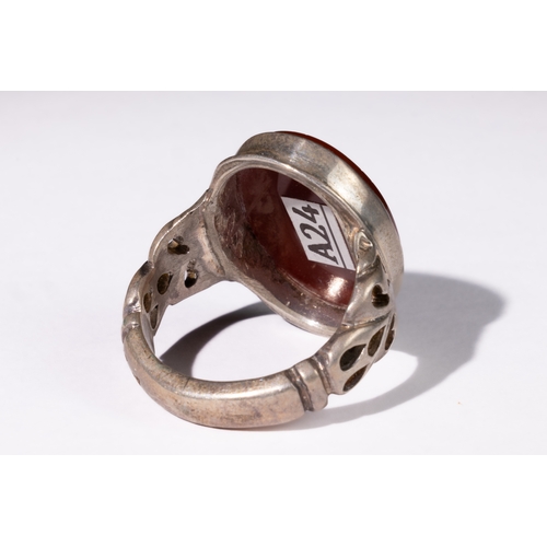 329 - **NO RESERVE** 

An Islamic Agate Silver Ring with Calligraphic Inscription.

This Islamic ring feat... 