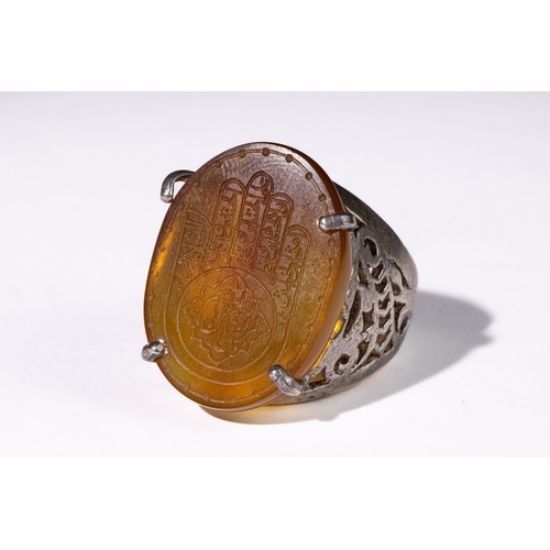 330 - **NO RESERVE** 

An Islamic Carnelian Silver Ring with Hand Motif.

Islamic ring featuring a carneli... 