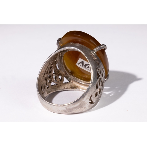 330 - **NO RESERVE** 

An Islamic Carnelian Silver Ring with Hand Motif.

Islamic ring featuring a carneli... 