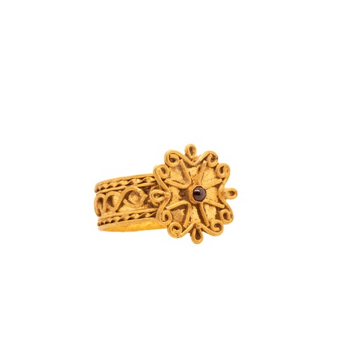 10 - A Byzantine Gold Ring with Garnet Floral Setting.

This Byzantine gold ring features an intricately ... 