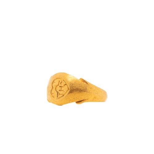 11 - A Byzantine Gold Signet Ring with an Engraved Inscription.

This Byzantine gold signet ring features... 