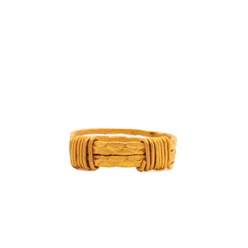 12 - A Viking Gold Ring with Coiled Wire Detailing.

This Viking gold ring features a design with three i... 